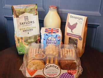 A Cotswolds complimentary starter pack containing fresh coffee, tea, sugar, fresh milk and biscuits